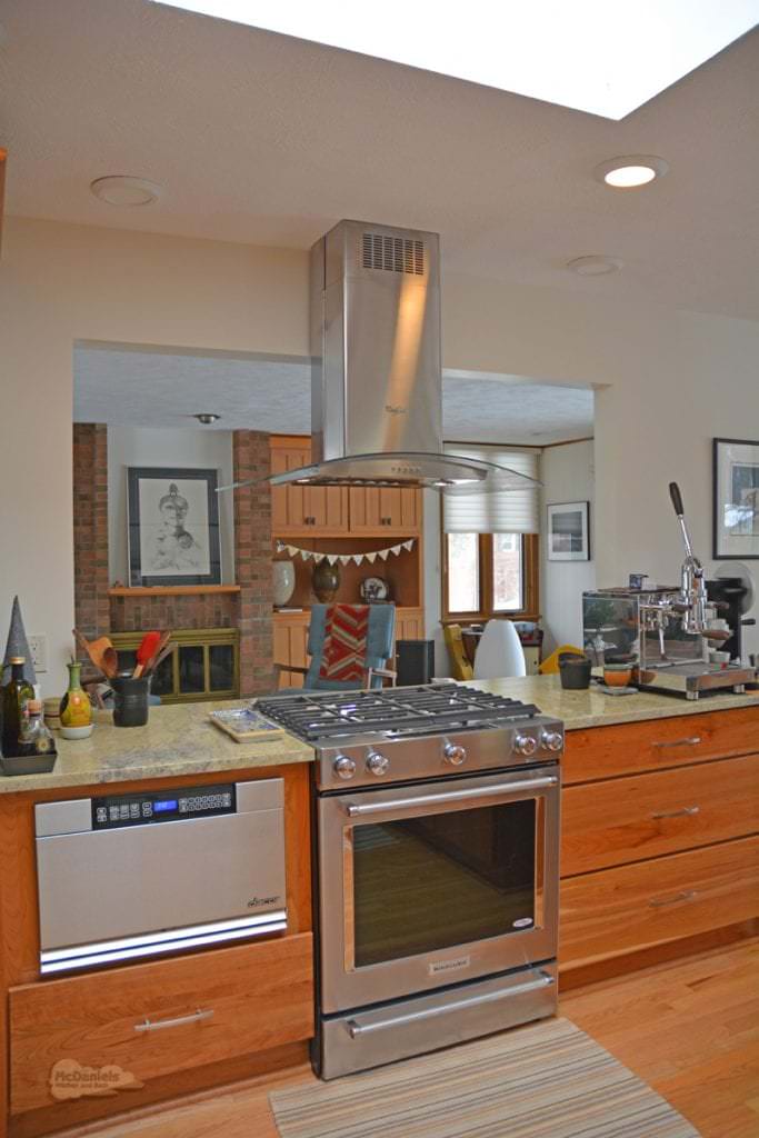 kitchen design with stainless and glass hood