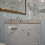 bath design with white shaker vanity