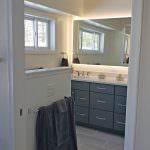 bathroom vanity and backlit mirror