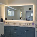 master bath vanity and backlit mirror