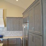 gray kitchen cabinets and white hood