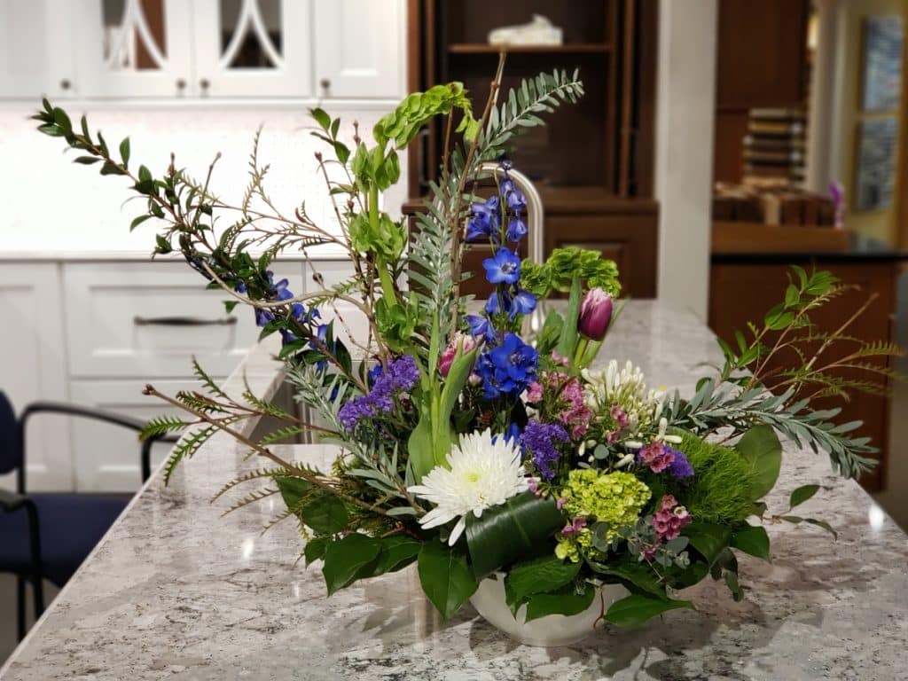 floral arrangement sitting on a countertop