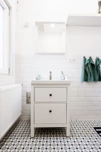 bathroom with furniture style vanity and tile floor