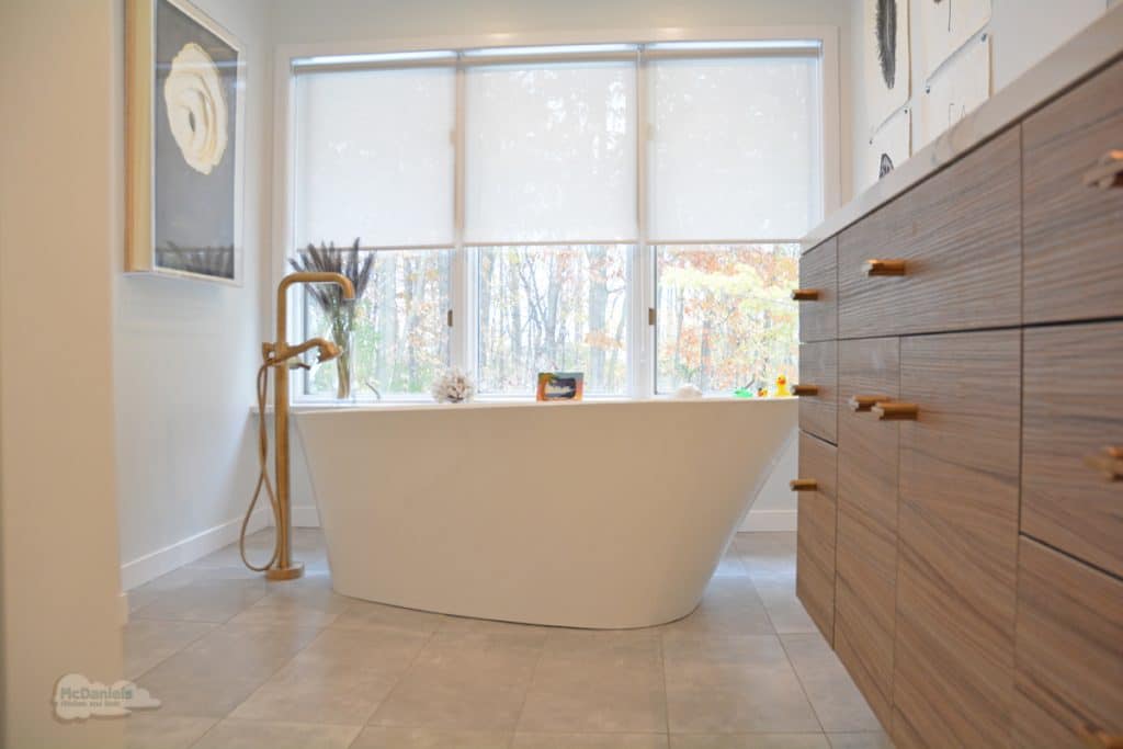 bath design with floating vanity and freestanding tub