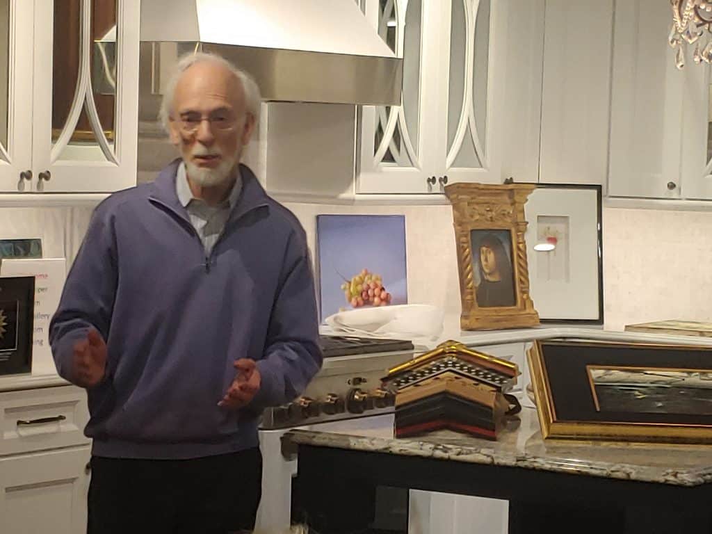 Roy Saper presenting artwork at an event